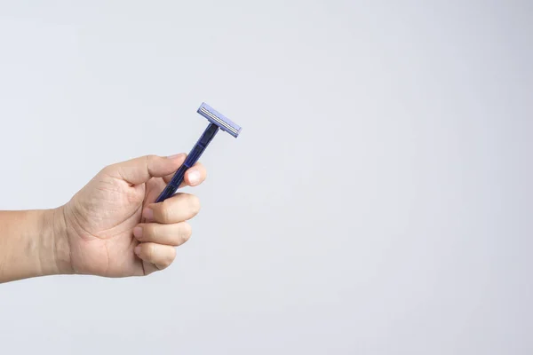 Hand holding shaving razor — Stock Photo, Image