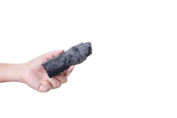 Hand hält natürliche schwarze Holzkohle aus Bambus zur Verwendung für — Stockfoto