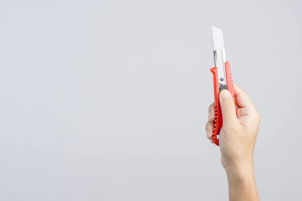 Hand holding office big paper cutter — Stock Photo, Image