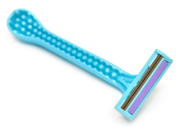 Afeitadora azul sobre fondo blanco. Piso tendido, vista superior — Foto de Stock