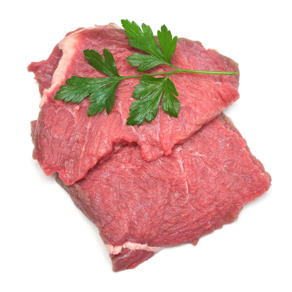 Fresh veal meat and parsley isolated on a white background. Raw 