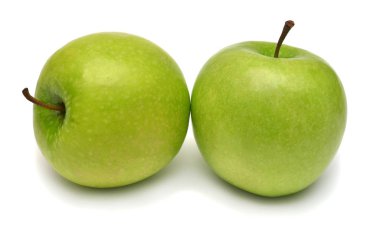 Beyaz arka planda izole edilmiş iki yeşil elma. Yaratıcı sağlıklı...