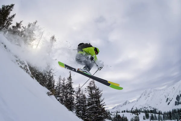 Ski freerider jumping thourgh trees — Stock Photo, Image