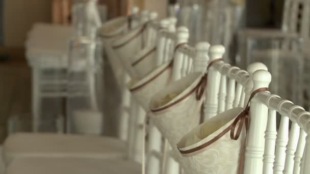 View of decorated chairs in banquet hall — Stock video