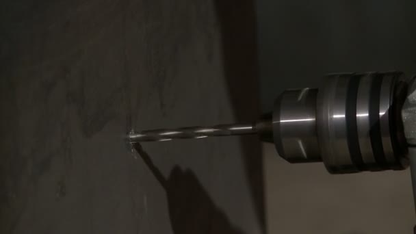 View of drilling wall by tool, close-up — Stockvideo