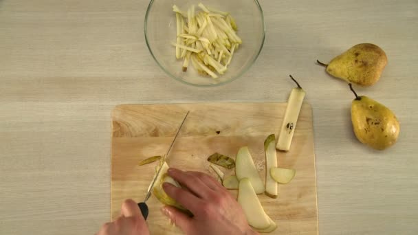 Process of pear slicing view from above — Stock Video