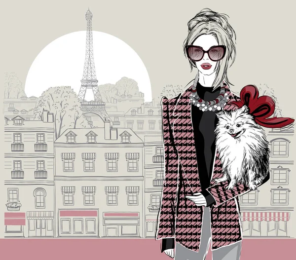 Modelo de mujer de moda con un perrito en el fondo de la ciudad de París — Archivo Imágenes Vectoriales