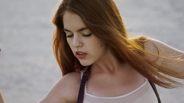 Close-up of excited girl with big eyes at sunset in slow motion — Stock Video