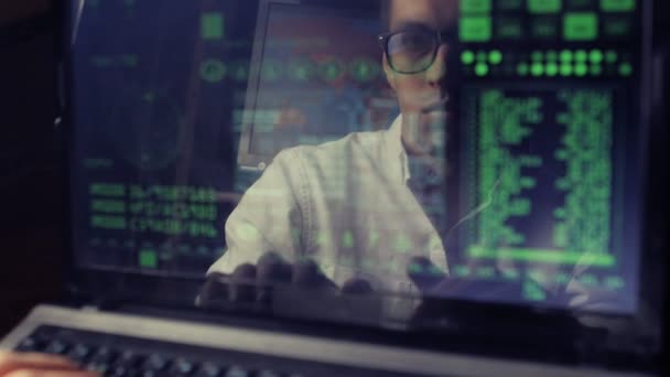 Double exposure shot of man hacker working at a laptop — Stock Video