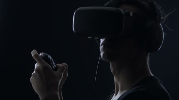 Virtual reality game. Close up of Man with pleasure uses head-mounted display — Stock Video