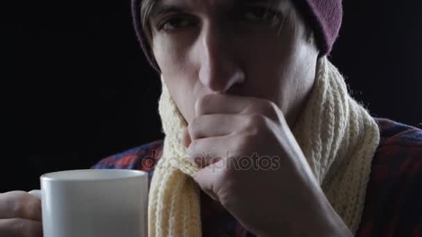 Close-up of sick man drinking hot tea — Stock Video