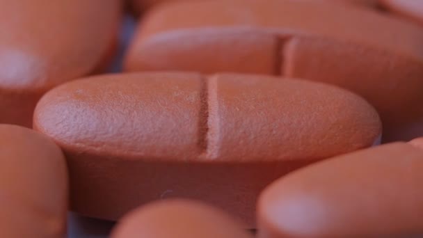Macro of red pills rotating — Stock Video