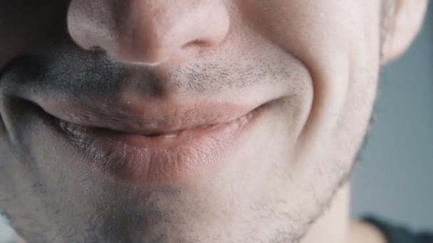 Young man laughing. Closeup on his mouth. — Stock Video