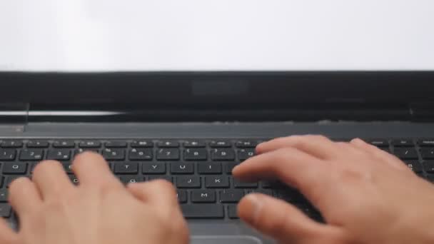 Close up of laptop keyboard. Mans hands typing text — Stock Video