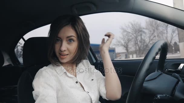 Beautiful brunette girl driving a car — Stock Video