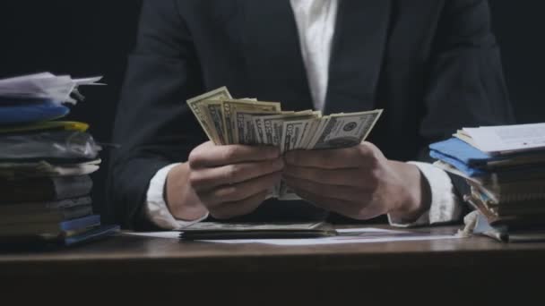 Close up hands of businessman at workplace counting money. Man counting Many American 100 bills. Concept of salary or making money. — Stock Video