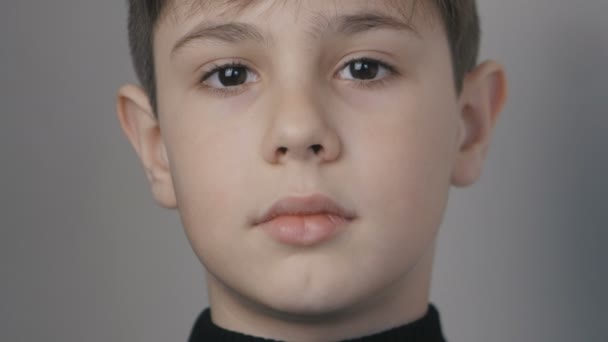 Close up portrait of little boy age 10 years looking at camera — Stock Video