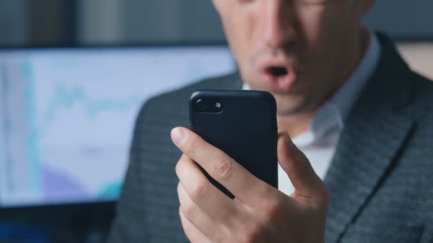 Close-up portrait Businessman using smartphone. Reaction of Win, Success by Excited Man get good news on his smart phone — Stock Video