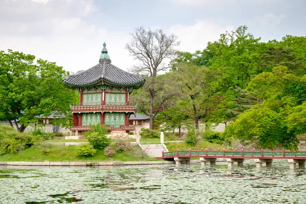 Hexagonal pavilion with a bridge crossing