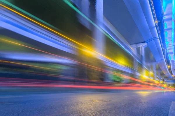 Blurred traffic light trails on road at night in China. — Stock Photo, Image