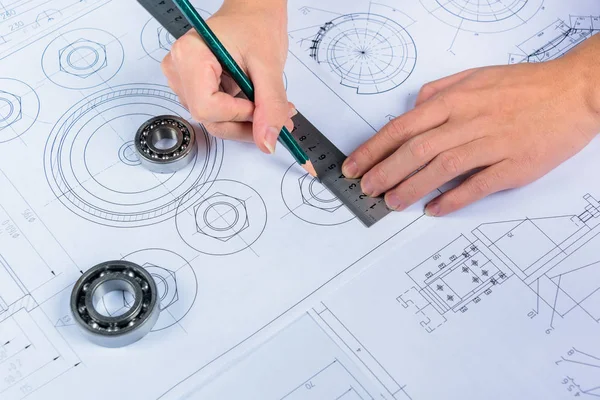 Young male architect working on plans, close-up — Stock Photo, Image