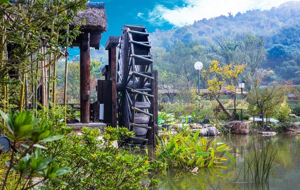Water Wheels On River Amidst Trees in Wuxi nianhuawan park