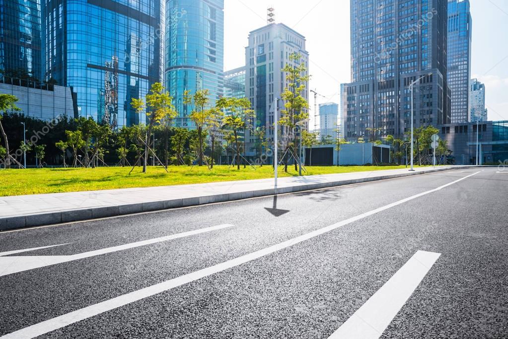 empty highway with cityscape and skyline 