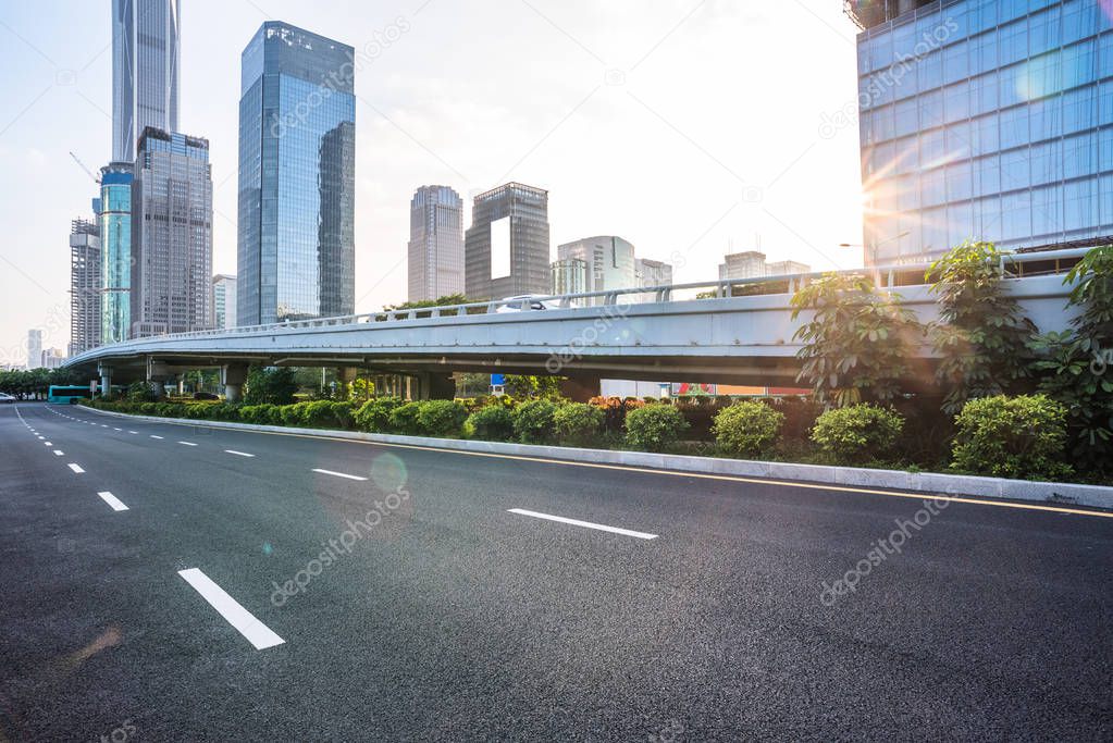 empty highway with cityscape and skyline 