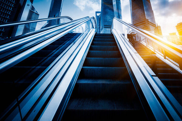 Escalator with cityscape in background of China.