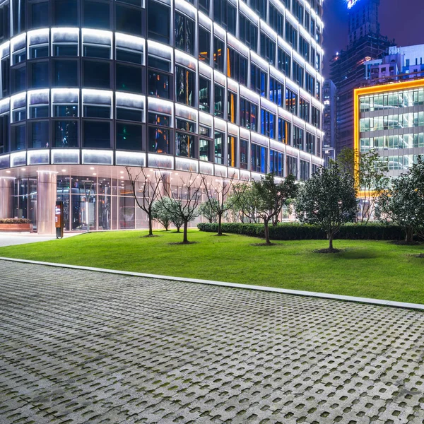 green lawn front of office block building