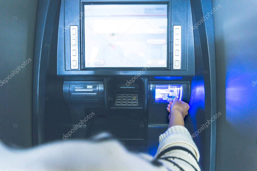 Woman using cash machine-ATM