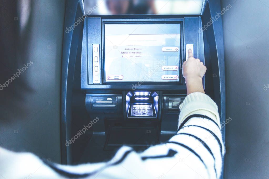 Woman using cash machine-ATM