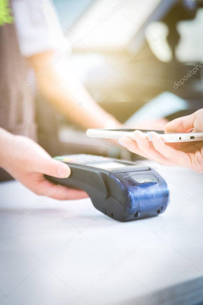 Close up of mobile payment in a shop