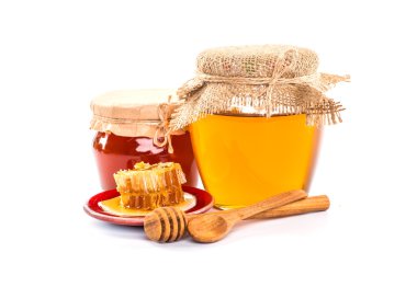 Tatlım, petek, polen ve propolis bir beyaz ile natürmort