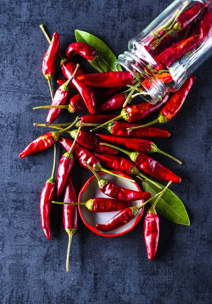 Chili peppers on a black background — Stock Photo, Image