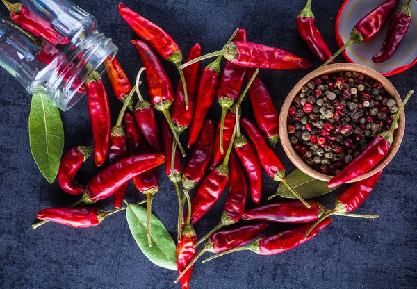 Chili peppers on a black background — Stock Photo, Image