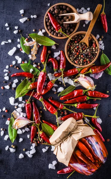 Chili peppers on a black background — Stock Photo, Image