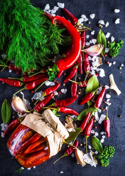 Chili peppers on a black background — Stock Photo, Image