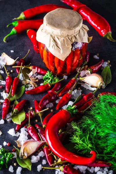 Chili peppers on a black background — Stock Photo, Image