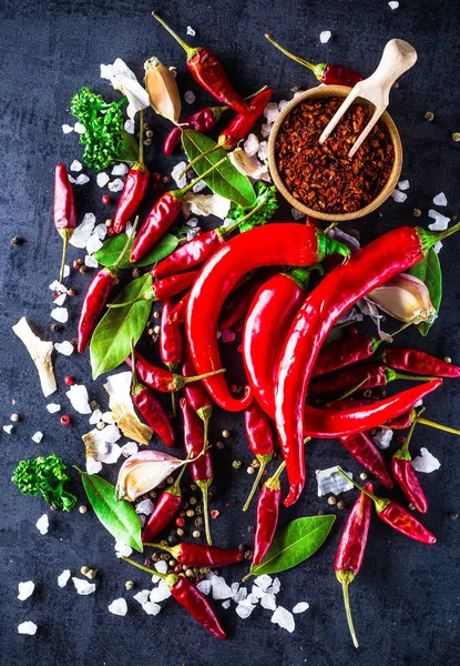 Chili peppers on a black background — Stock Photo, Image