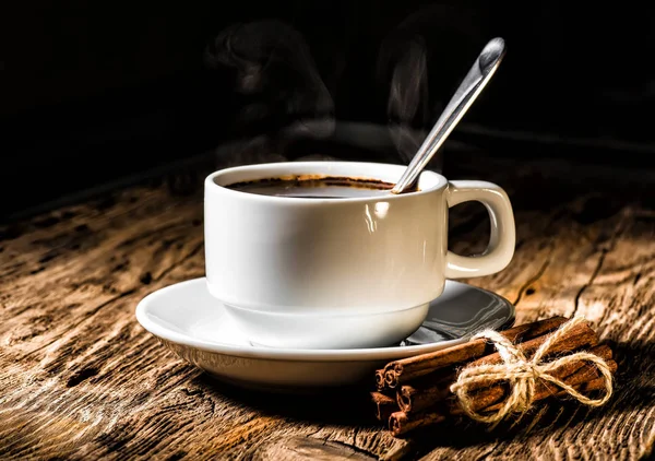 Coffee cup and saucer on a wooden table. — Stock Photo, Image