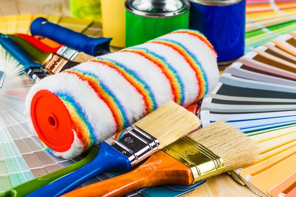 Painter and decorator work table with house project, color swatc — Stock Photo, Image