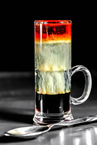 Multi-layered cocktail on bar — Stock Photo, Image