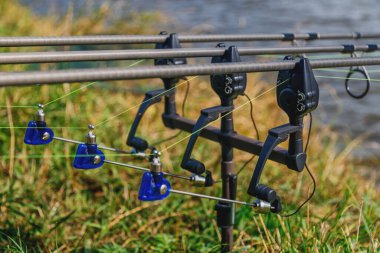 Fishing adventures, carp fishing. Carp fishing rods set up on ho