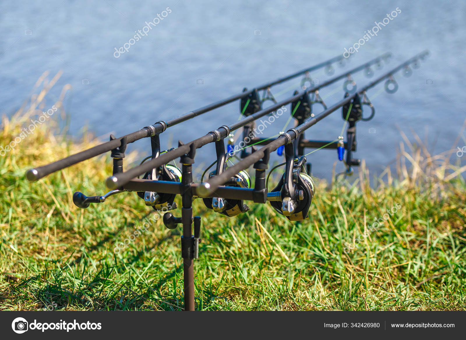Fishing adventures, carp fishing. Carp fishing rods set up on ho Stock  Photo by ©bukhta79 342426980