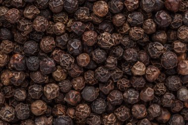 Biber arkaplanı. Kuru karabiber çekirdeği. Üst Manzara. Düz dizayn. Makro baharat arkaplanı