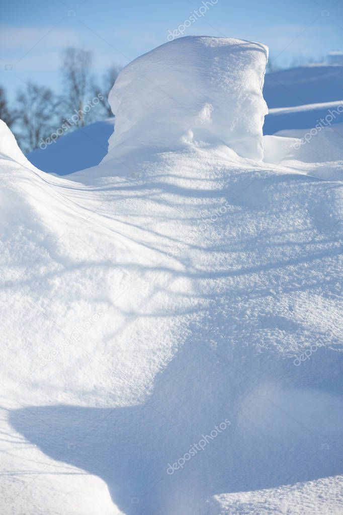 Snowdrift of the original form on a fine winter day. Close-up. S