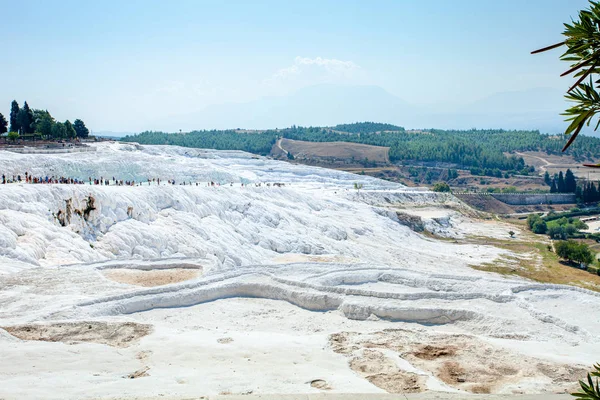 View of the unique Pamukkale natural complex with white cliffs.