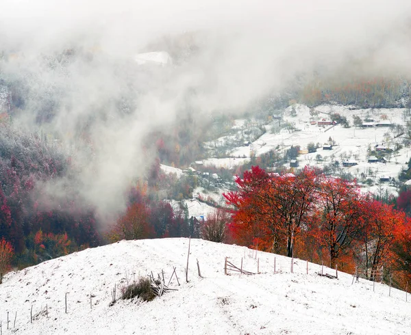 First snow fall in the Carpathian village — Stock Photo, Image