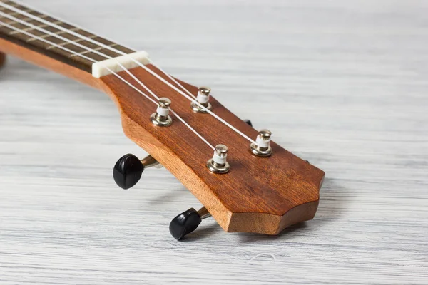 Close up of ukulele on old wooden background — Stock Photo, Image